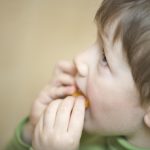 Young boy eating